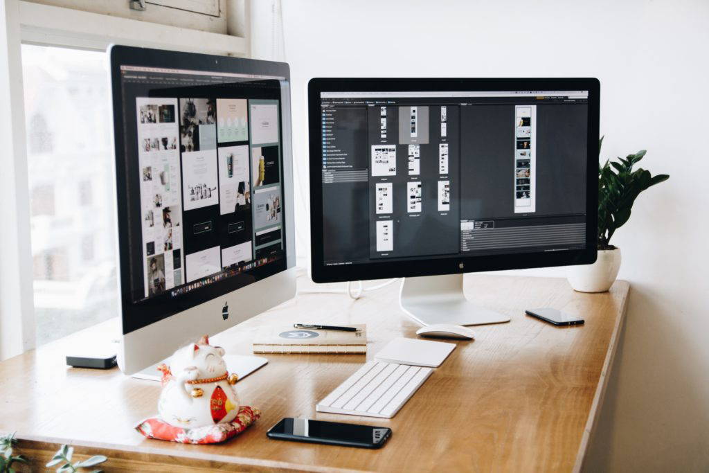 two imacs on desk